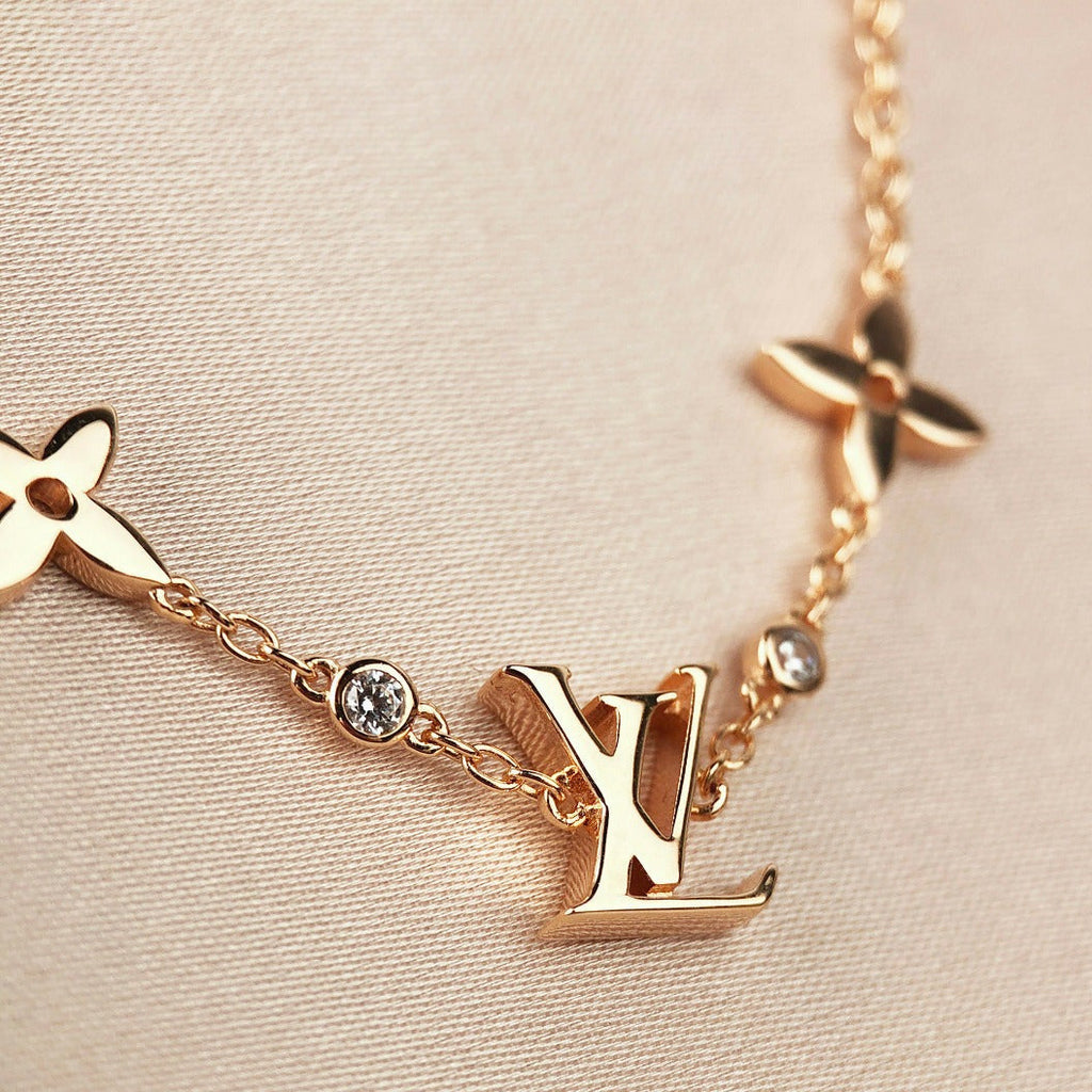 Aura STAR AND SUN 7 MOTIFS GOLD BRACELET