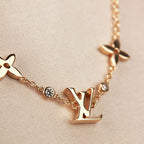 Aura STAR AND SUN 7 MOTIFS GOLD BRACELET