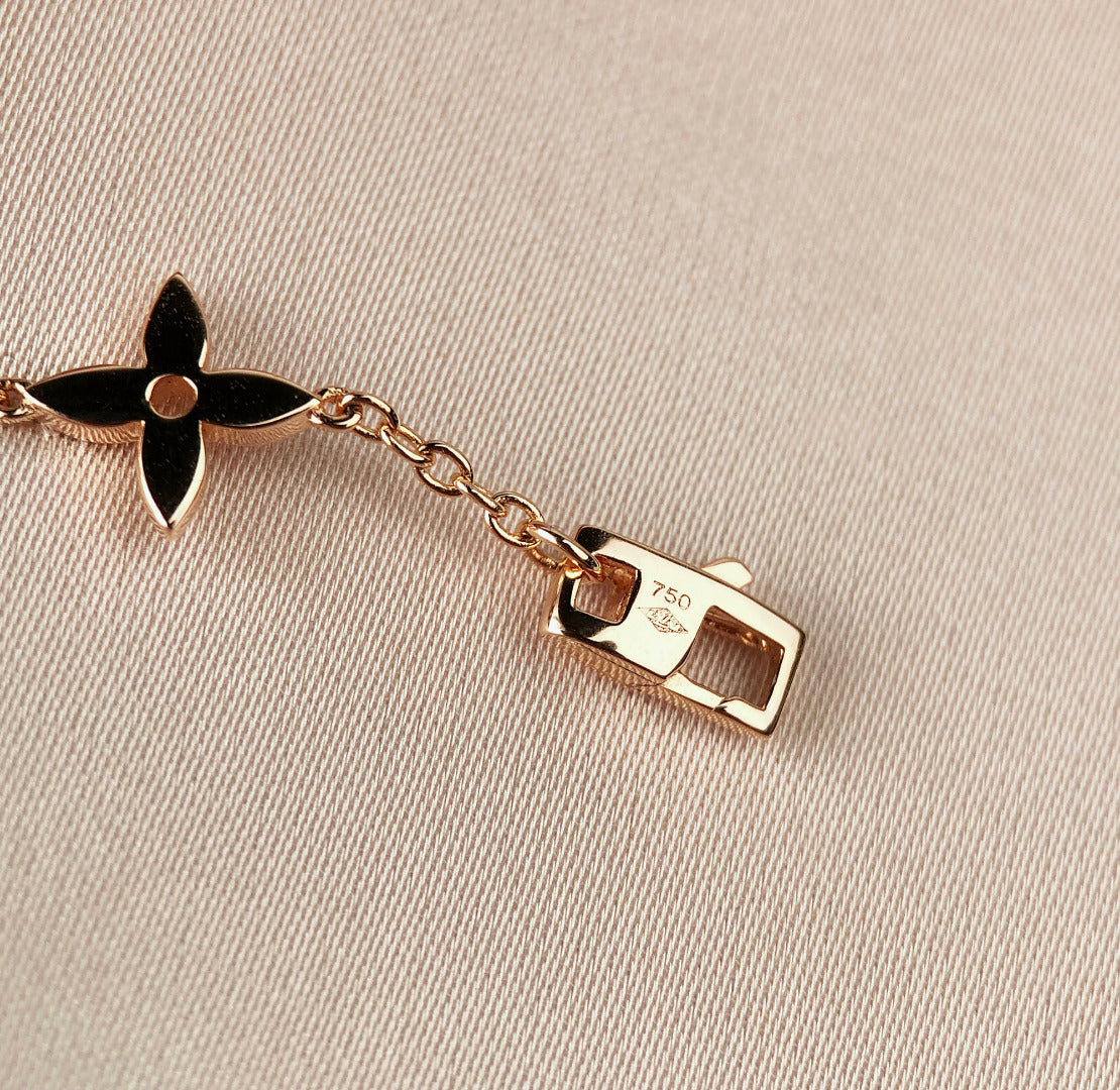 Aura STAR AND SUN 7 MOTIFS GOLD BRACELET
