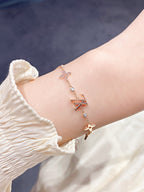 Aura STAR AND SUN 7 MOTIFS GOLD BRACELET