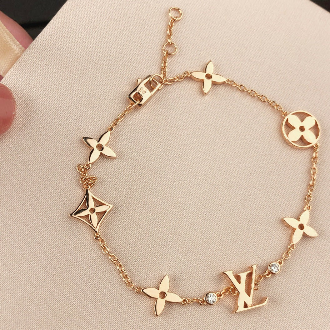 Aura STAR AND SUN 7 MOTIFS GOLD BRACELET
