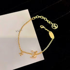 Aura LOGO STAR MOTIF GOLD BRACELET