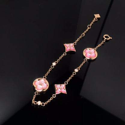 Aura STAR AND SUN 4 MOTIF PINK MOP PINK GOLD ARMREIF