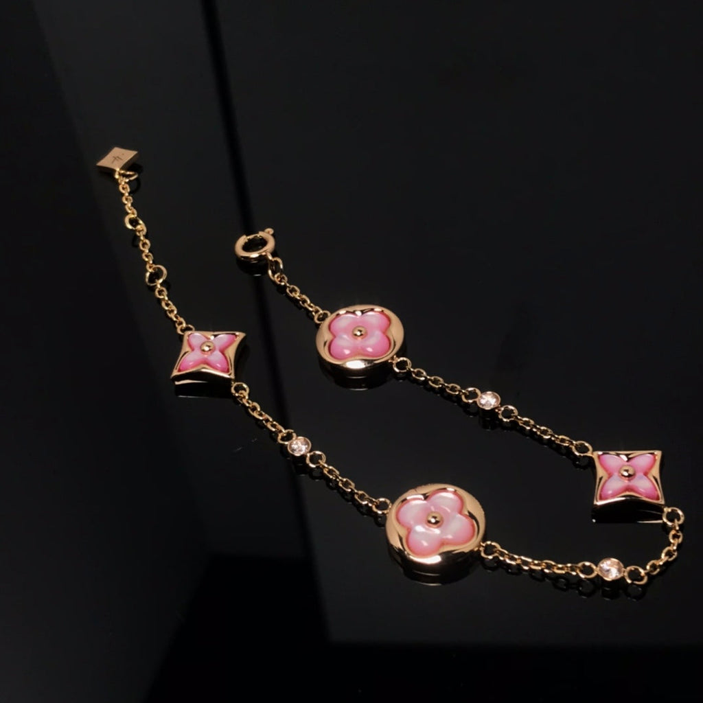 Aura STAR AND SUN 4 MOTIF PINK MOP PINK GOLD BRACELET