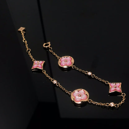 Aura STAR AND SUN 4 MOTIF PINK MOP PINK GOLD ARMREIF