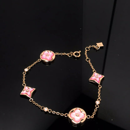 Aura STAR AND SUN 4 MOTIF PINK MOP PINK GOLD ARMREIF