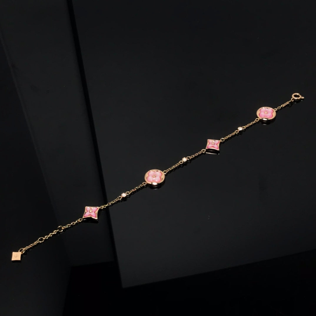 Aura STAR AND SUN 4 MOTIF PINK MOP PINK GOLD BRACELET