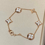 Aura STAR AND SUN 5 MOTIF MOP PINK GOLD BRACELET