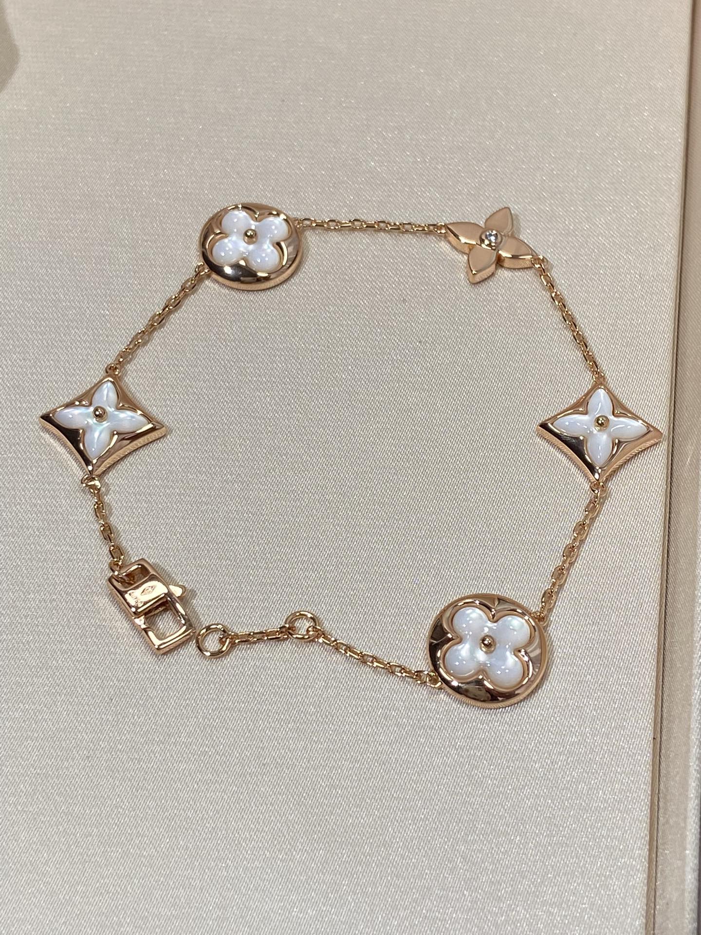 Aura STAR AND SUN 5 MOTIF MOP PINK GOLD BRACELET