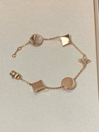 Aura STAR AND SUN 5 MOTIF MOP PINK GOLD BRACELET