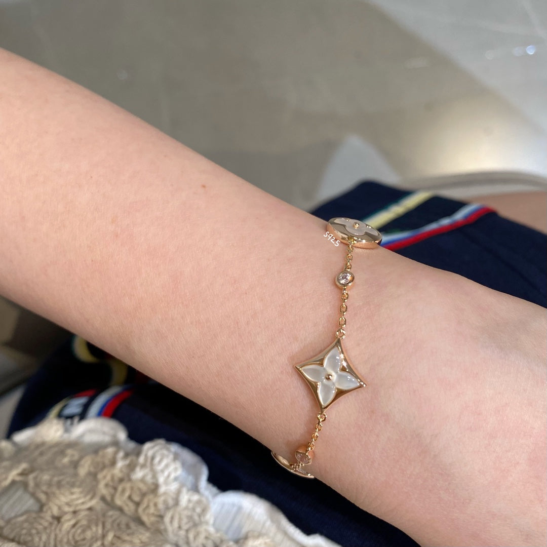 Aura STAR AND SUN 4 MOTIF WHITE MOP PINK GOLD BRACELET