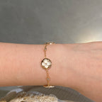 Aura STAR AND SUN 4 MOTIF WHITE MOP PINK GOLD BRACELET
