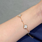Aura STAR AND SUN 4 MOTIF WHITE MOP PINK GOLD BRACELET