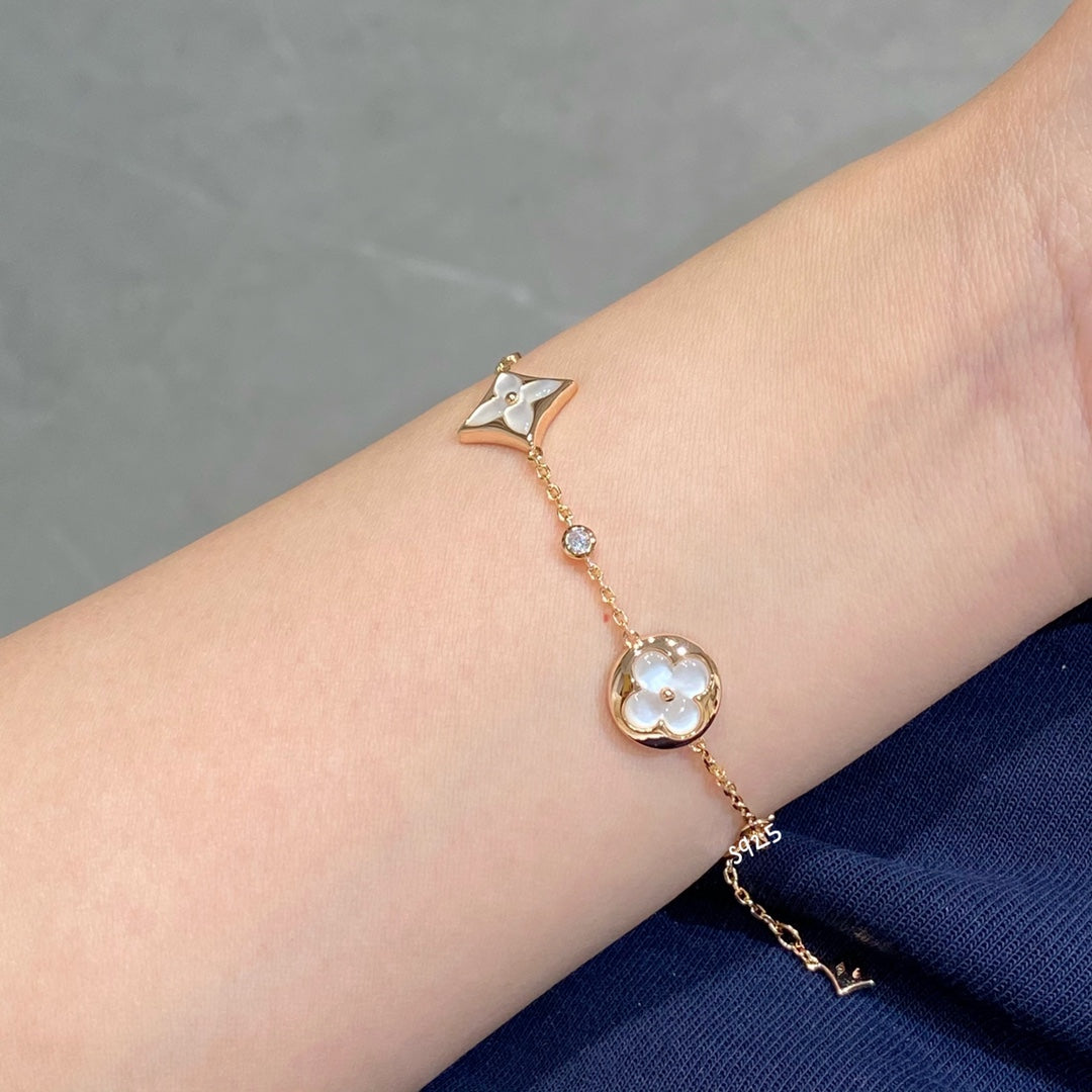 Aura STAR AND SUN 4 MOTIF WHITE MOP PINK GOLD BRACELET