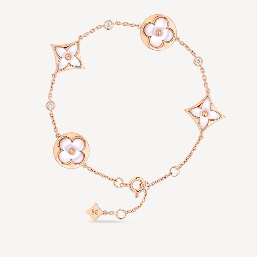Aura STAR AND SUN 4 MOTIF WHITE MOP PINK GOLD BRACELET