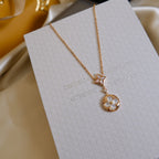 Aura STAR AND SUN WHITE MOP 2 MOTIF PINK GOLD NECKLACE