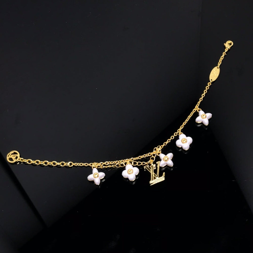 Aura LOGO 6 MOTIV STERNE UND SONNE GOLDENES ARMBAND
