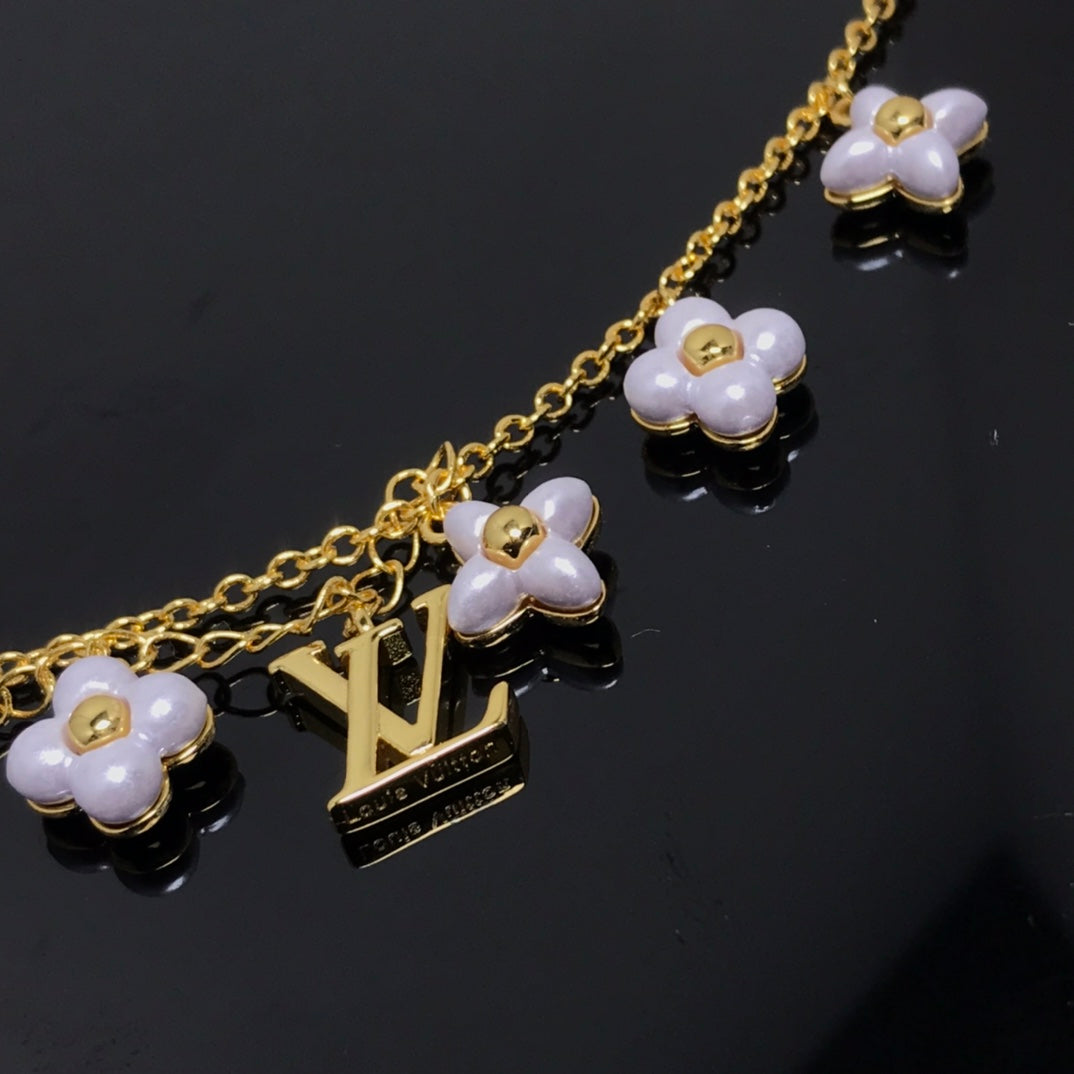 Aura LOGO 6 MOTIF STAR AND SUN GOLD BRACELET