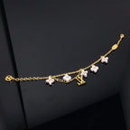 Aura LOGO 6 MOTIV STERNE UND SONNE GOLDENES ARMBAND