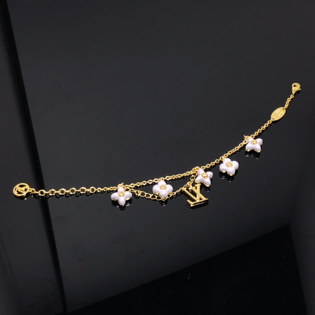 Aura LOGO 6 MOTIF STAR AND SUN GOLD BRACELET
