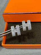 Aura H STUD EARRINGS WITH SILVER DIAMONDS