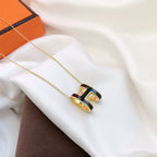Aura HM CLIC BLACK ENAMEL GOLD NECKLACE