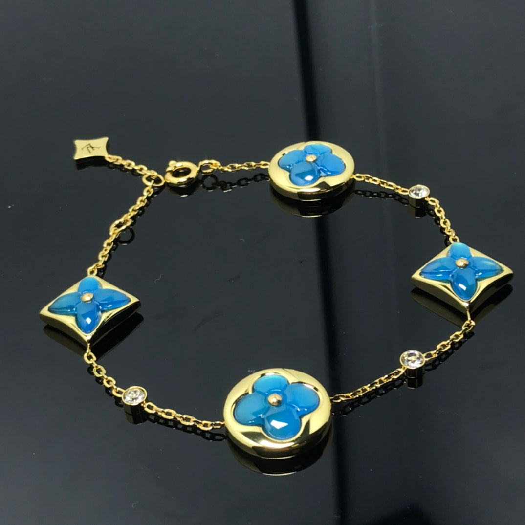 Aura STAR AND SUN 4 MOTIF BLUE BRACELET