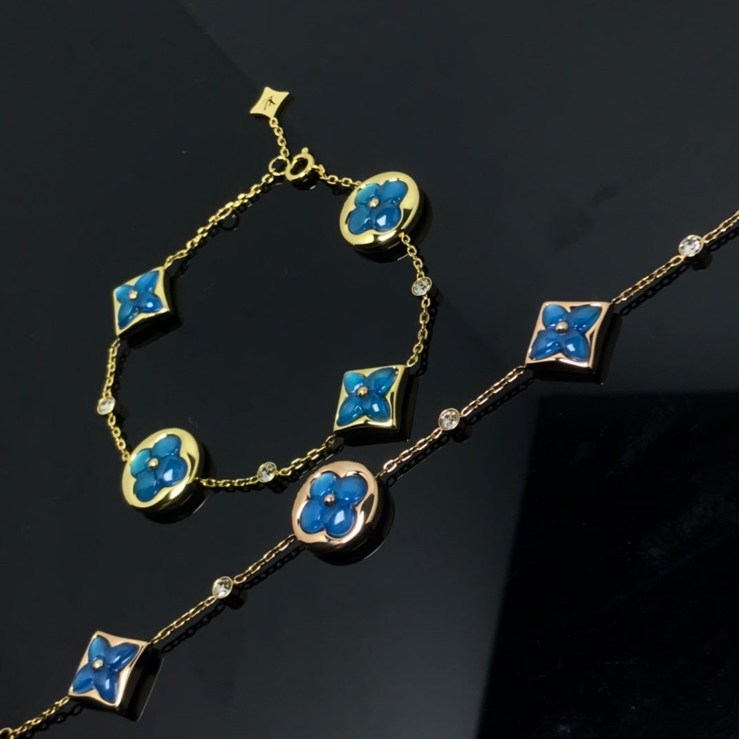 Aura STAR AND SUN 4 MOTIF BLUE BRACELET